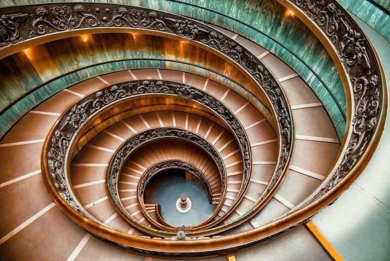 54 Most Instagrammable Places in Rome 35 Bramante staircase at the Vatican in hues of orange and aqua.